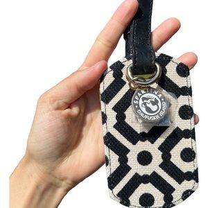 Black and white polka dot luggage tag with silver keychain